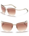 Rimless sunglasses with crossover bar detail and curved arms, a ultra chic style from DIANE von FURSTENBERG.