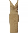 The ultimate figure-hugging dress, this draped Donna Karan favorite will have you turning heads while maintaining comfort - V-neckline with faux wrap detail, sleeveless, front and back twist drape detail, fitted pencil silhouette - Style with statement sandals, a draped front leather jacket, and a studded clutch