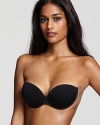 A strapless and backless underwire bra with adhesive tape at sides for a supportive fit.