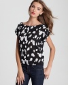 Alice + Olivia's monochromatic printed top makes a chic addition to your workday wardrobe.