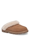 Slip into these comfy and cozy slippers with a genuine shearling cuff and front seam detail with UGG® logo.