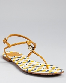 Simply the essence of chic, easy summer style, these slim-strapped flats are equally at home on city streets and sandy beaches. By Tory Burch.