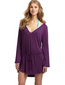 THE LOOKV-neckLong sleevesDropped waist with drawstring closureSide slits at hemTHE FITAbout 30 from shoulder to hemTHE MATERIAL95% rayon/5% spandexCARE & ORIGINHand washMade in USAModel shown is 5'10 (177cm) wearing US size Small. THE LOOKV-neckLong sleevesDropped waist with drawstring closureSide slits at hemTHE FITAbout 30 from shoulder to hemTHE MATERIAL95% rayon/5% spandexCARE & ORIGINHand washMade in USAModel shown is 5'10 (177cm) wearing US size Small.