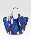 Take it with you in the morning and your set for the day, as this roomy nylon tote in a bold geometric print holds all your gear and whatever you pick up along the way. Double leather shoulder straps, 9 drop Magnetic snap close Inside zip pocket Nylon with signature nylon lining 24W X 14H X 6D Made in Italy