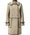 Luxurious trench coat made ​.​.of fine, beige cotton - The eye-catcher is the black leather piping, it gives the coat a modern finish - With typical trench features: double breasted, with sleeve bars - Cut straight and slim (makes you look slender), in a feminine thigh length - An awesome all-around coat, a dream piece that looks elegant and classic on one hand and fashionable and feminine on the other - Wear with jeans for leisure, a business suit for work and for evening, a cocktail dress