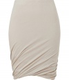 Sumptuously soft and effortlessly elegant, Donna Karans pure, beige cashmere knit skirt epitomizes understated luxury - Curve-hugging, medium-rise pull on style with hidden elasticated waist - Gorgeous signature drape and twist detail at hem - A chic go-to in any wardrobe perfect for pairing with cashmere pullovers, silk tops or button downs and ankle booties or platform pumps