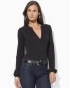 Sleek stretch jersey forms the foundation of a chic split-neck top.
