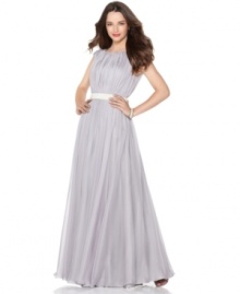 JS Collections' evening gown features tight pleating at the bodice that gradually, gracefully softens for a flowing skirt. The beaded waistband is a charming finishing touch that also accentuates your figure!