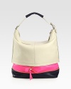 Sumptuous leather in a bold colorblocked palette, finished with an extendable bottom zip-panel.Shoulder strap, 8 dropTop zip closureProtective metal feetOne inside zip pocketTwo inside open pocketsCotton lining16½W X 14H X 6DImported