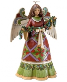 Ready to hang a string of festive garland, this folk-inspired angel will quickly become a centerpiece in your home. A geometric print dress, flourished wings and a wash of Christmas color add a timeless warmth.