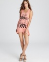 A vintage-inspired graphic imbues this ultra-abbreviated Rebel Yell tank dress with retro flair.