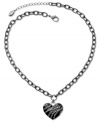 Crush-worthy style from GUESS. This dark necklace features a heart pendant adorned with jet epoxy and glass accents. Crafted in hematite tone mixed metal. Approximate length: 16 inches + 2-inch extender. Approximate drop: 1 inch.