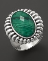 A faceted malachite doublet is trimmed in fluted sterling silver on this classic Lagos ring.