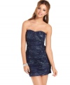 Sparkling glitter design explodes like fireworks over a strapless dress of deep, inky hue! From BCX.