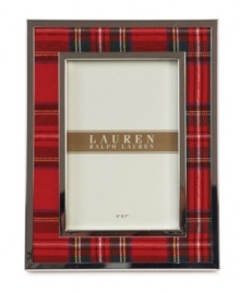 Bring great memories to the forefront with the Clearly Tartan picture frame. Classic red plaid edged in silver plate trims your decor with the traditional prep and polish of Lauren Ralph Lauren.