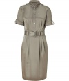 Utilitarian-chic styling gets an ultra feminine remix in Burberry Londons pebble silk sheath, tailored to perfection with soft pleating around the waistline - Small button-down collar, short sleeves with buttoned tabs, epaulettes, partial button-down front, belted waistline, belt loops, kick pleat, tailored fit - Pair with platform pumps and color-pop accessories
