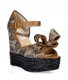 Get noticed in these statement sandals of the season from Valentino - Peep-toe, bow front detail, lace overlay, ankle strap with buckle closure, braid detailed platform wedge heel - Style with a mini-dress, a boyfriend blazer, and a studded clutch