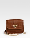 Supple leather in a sophisticated petite design accented with goldtone hardware.Detachable chain and leather shoulder strap, 22 dropFlip-lock flap closureTwo inside open pocketsBack zip pocketCotton lining8¾W X 7H X 3½DImported