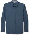 Make a lasting impression with this handsome solid shirt by Volcom.