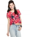 An assembly of dark bows overlay an open back on this crop top from Material Girl that's cool on the flip side, too!