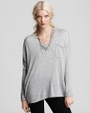 An boxy heather grey 525 America sweater makes getting dressed for weekend brunch dates easy. Exposed seams and a chest pocket lend the boxy silhouette style for a cool finish.