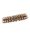 The lustrous chocolate brown color of Charter Club's two-row simulated pearl (6 mm) stretch bracelet makes it a perfect complement to your fall wardrobe. Made in gold tone mixed metal. Approximate diameter: 2-1/2 inches.