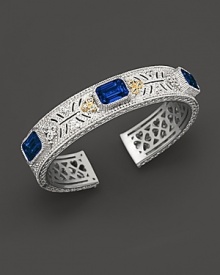 Sterling silver cuff set with faceted white sapphires and corundum. By Judith Ripka.