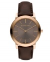 This Burberry timepiece features a brown leather strap and round rose-gold ion-plated stainless steel case with sapphire crystal. Textured taupe dial with smooth sunray inner dial features rose-gold tone stick indices, two hands and logo. Swiss quartz movement. Water resistant to 30 meters. Two-year limited warranty.