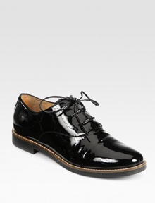 A menswear-inspired silhouette in patent leather with charming laces. Stacked heel, 1 (25mm)Patent leather upperLeather liningRubber solePadded insoleMade in Italy