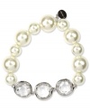 Chunky sophistication from Givenchy. Large stones in glass crystal and cubic zirconia add elegance to this stretch bracelet. Stretches to fit wrist. Crafted in imitation rhodium plated mixed metal. Approximate diameter: 1-7/8 inches.