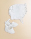 Perfect for a christening or other formal events, our exquisite bonnet-and-bootie set is hand-crocheted from luxuriously soft Pima cotton and finished with timeless heritage details for a precious heirloom look. Bonnet Buttoned chin strapBack panel with double-layered scalloped trim Booties Knit strap fastens over a knit pom-pom ankleSatin ribbon lacingPima cottonHand washImported