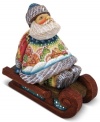 A beautiful work of art on its own, this ornament from DeBrehkt features an exquisitely carved Santa Claus sitting on a sleigh with a quaint, snowy village landscape hand painted upon his sweater.