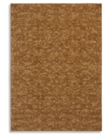 Crafted to impart a vintage wear and lush visual texture, this Karastan rug features subtle fabric-like patterning inspired by the organic designs found in granite and marble. Machine woven from 100% wool in a hushed curry-orange hue. Crafted to impart a vintage wear and lush visual texture, this Karastan rug features subtle fabric-like patterning inspired by the organic designs found in granite and marble. Machine woven from 100% wool in a hushed curry-orange hue.