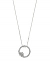 Eternal design accented by just the right amount of sparkle. 2028 pendant features a cut-out circular style accented by a chic flower and acrylic stones. Setting and chain crafted in silver tone mixed metal. Approximate length: 16 inches + 3-inch extender. Approximate drop: 1-1/4 inches.