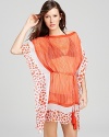 Wear DIANE von FURSTENBERG's thigh-grazing caftan poolside in Palm Springs to channel bold bohemian style.