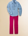 Inspired by the boys, this button-front chambray shirt gets a girlie makeover with a frilly ruffle trim along the front.Spread collarLong sleeves with single-button cuffsButton front with ruffle trimShirttail hemCottonMachine washImported Please note: Number of buttons/snaps may vary depending on size ordered. 