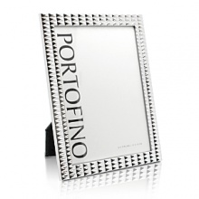 Detailed with a bold studded pattern in gleaming plated silver, this unique frame from Argento brings fashion-forward style to favorite photographs. Detailed with a bold studded pattern in gleaming plated silver, this unique frame from Argento brings fashion-forward style to favorite photographs.