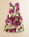 A lush, vivid floral print on pure cotton is sprinkled with sheer layered flowers adding rich dimension.Scoop necklineSleevelessSewn waistFull pleated skirtBold back zipperFully linedCottonDry cleanImported