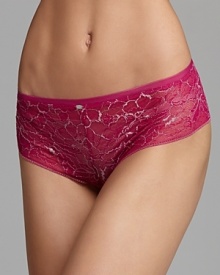 A floral lace hipster with sheer lace trim along legs from Calvin Klein. A floral lace hipster with sheer lace trim along legs from Calvin Klein.