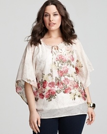 An ambrosial-inspired print on a flowing silhouette brings boho elegance to this Karen Kane blouse. An ambrosial-inspired print on a flowing silhouette brings boho elegance to this Karen Kane blouse.