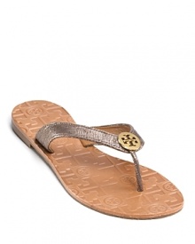 Natural beauty. Shimmering suede and leather thongs, topped with a Tory Burch logo, are a true neutral.