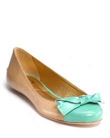 Glossy color jazzes up the Tabby flats from Kate Spade, finished with a charming, bow-adorned cap toe. Glossy color jazzes up the Tabby flats from Kate Spade, finished with a charming, bow-adorned cap toe.
