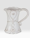 Bring the outdoors inside with a smaller, hand-finished stoneware pitcher beautifully detailed with a scrolling design that celebrates the splendor and romance of the world's most beautiful gardens. Chip resistant 5 high Dishwasher safe Imported