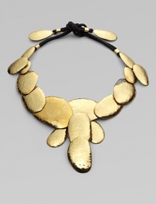 A striking series of multi-sized hammered discs makes a glowing statement in this bold, golden design.BrassCotton cordingLength, about 48 (adjustable)Tie closeImported A striking series of multi-sized hammered discs makes a glowing statement in this bold, golden design.BrassCotton cordingLength, about 48 (adjustable)Tie closeImported
