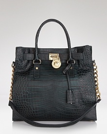 Clean and simply detailed, this versatile MICHAEL Michael Kors tote flaunts effortless style on-duty or off. Clean and simply detailed, this versatile MICHAEL Michael Kors tote flaunts effortless style on-duty or off.