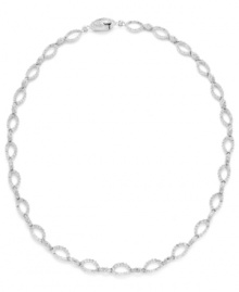 Shape up with a little shimmer. Eliot Danori's intricate oval link necklace glistens with the addition of round-cut crystals. Set in silver tone mixed metal. Approximate length: 16 inches. Shape up with a little shimmer. Eliot Danori's intricate oval link necklace glistens with the addition of round-cut crystals. Set in silver tone mixed metal. Approximate length: 16 inches.