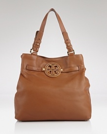 Tory Burch's leather tote is the daytime bag on every label lover's list. On weekends, this bag slips over a bold coat to lend a practical dose of chic. Tory Burch's leather tote is the daytime bag on every label lover's list. On weekends, this bag slips over a bold coat to lend a practical dose of chic.