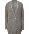 Raise the bar on modern essentials with Closeds elegant heather grey long cardigan - Larger weave, acrylic and wool knit - Double breasted cut with deep v-neck and two rows of buttons - Single pocket at left hip - Rib trim at cuffs and hem - Cardigan hits mid-thigh -  Slim, straight silhouette - Casually chic, perfect for pairing with skinny denim, pencil skirts and cigarette pants