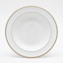 Rings of gold adorn fine white bone china with the lustrous shine of a wedding band. White bone china features two different border trims of gold, a wide corded border of textured grosgrain ribbon on some pieces, a narrow edge on others. Rings of gold adorn fine white bone china with the lustrous shine of a wedding band. White bone china features two different border trims of gold, a wide corded border of textured grosgrain ribbon on some pieces, a narrow edge on others.