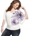 Celebrate the season with ING's dolman sleeve plus size top, finished by a floral print and banded hem.